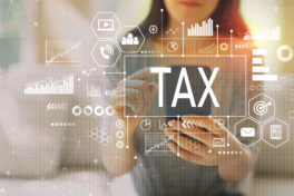 Tax with woman using a smartphone